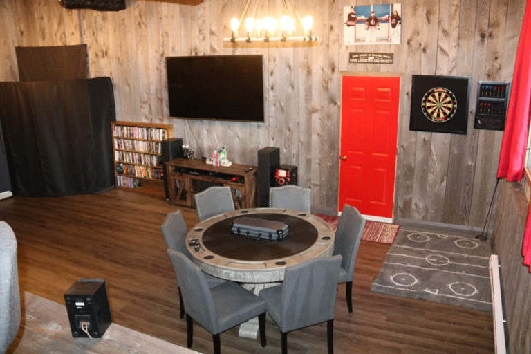 poker table and tv games room