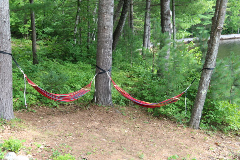 hammocks outside log chalets in quebec