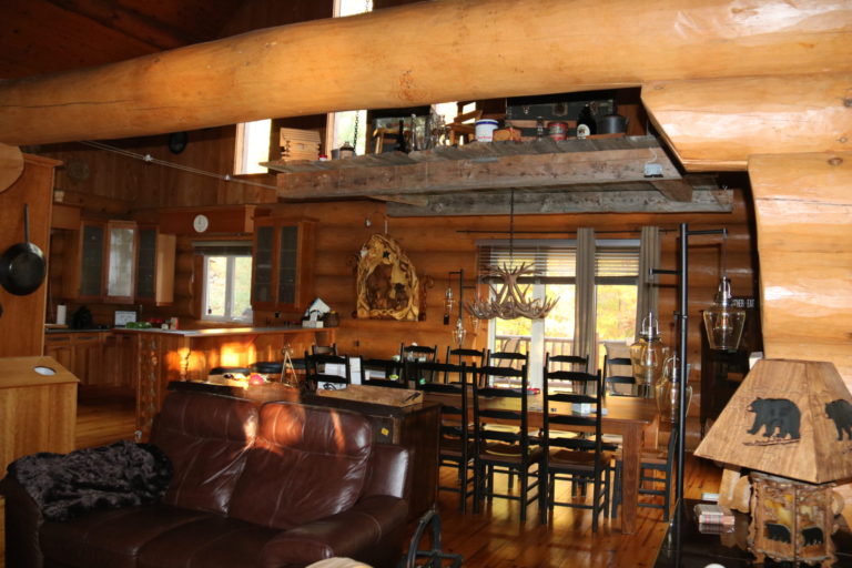 view of dining and kitchen in Quebec family cottage near Ottawa