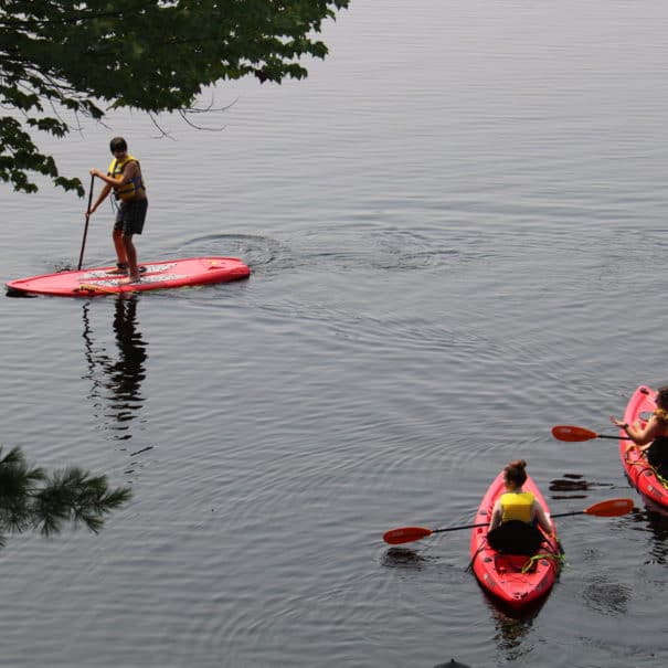 teens in kayaks