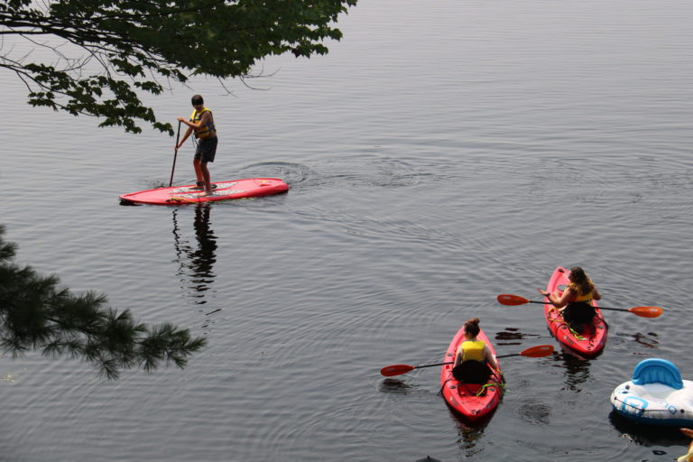 teens in kayaks