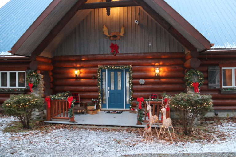 front step of log cottage at Christmas