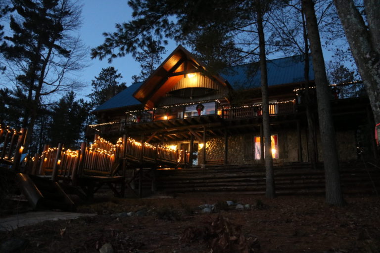 log cottage at night