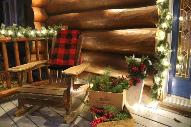 wooden rocking chair on front step at Christmas