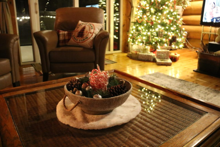 Christmas decor on table with bells and candy canes