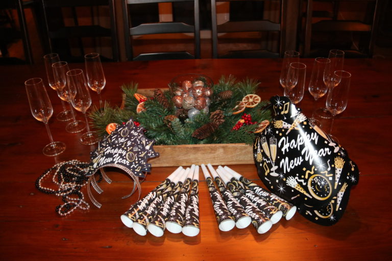 new years eve blowers and hats on dining table