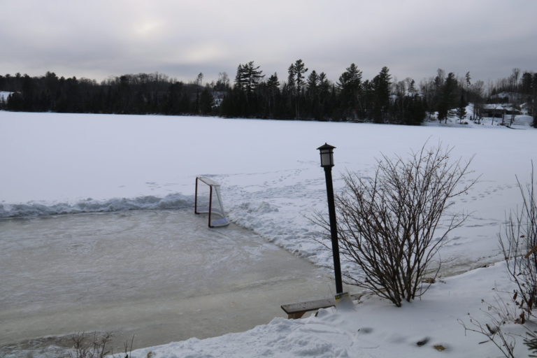 hockey rink on lake in cottage in quebec