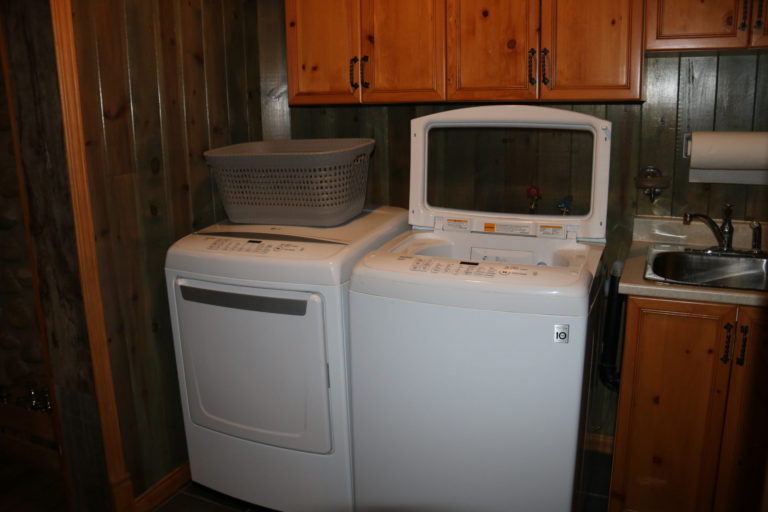 washer and dryer with grey laundry tub on top