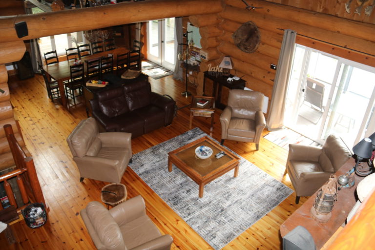 loft view of main floor log cottage in Quebec