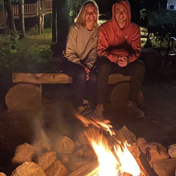 two people at campfire