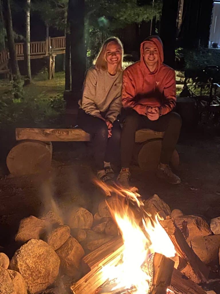 two people at campfire