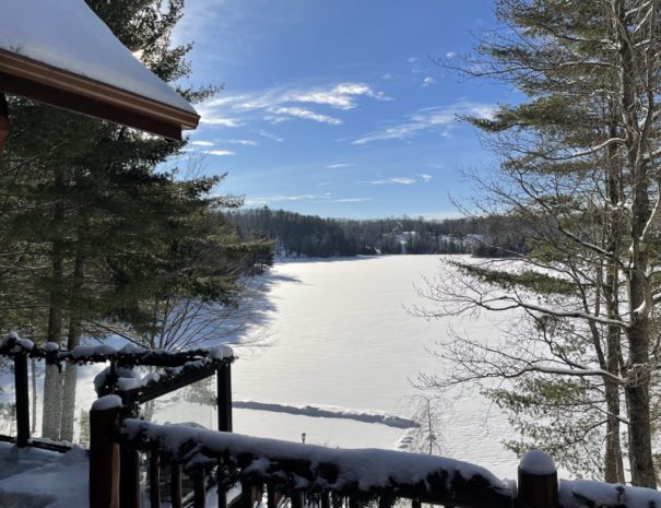 snow covered lake at log cottage rental near ottawa