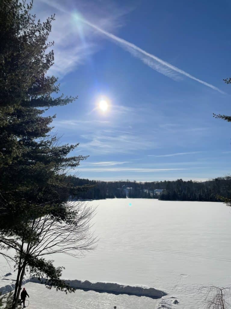 winter with sun shining on lake