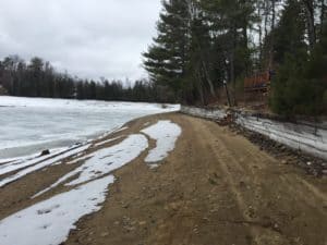 beach with drop off to lake in spring Quebec cottage rental