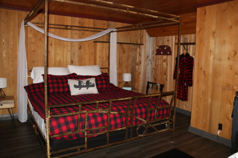 king bed with red duvet cottage rentals near ottawa